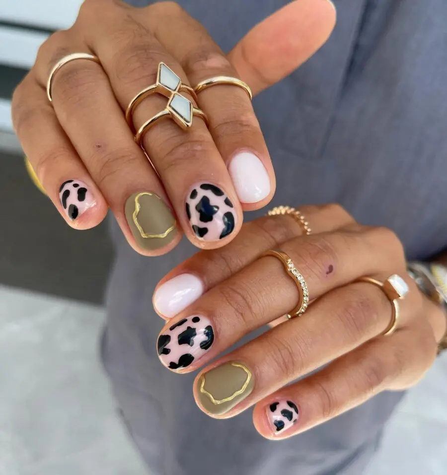 Stylish Cow Print Nails with Chic Accents