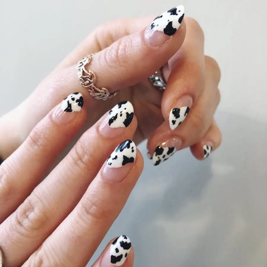 Trendy cow print nails for a fun look