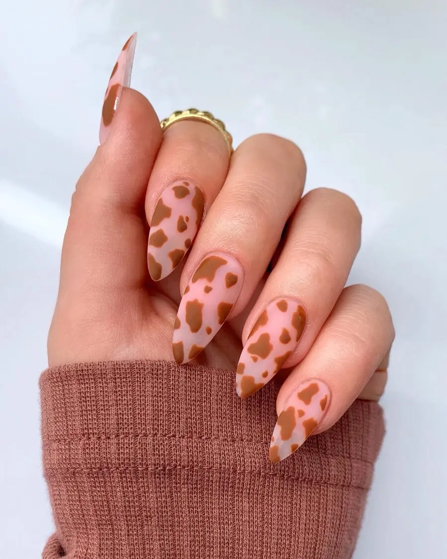 Chic cow print nails with stylish flair