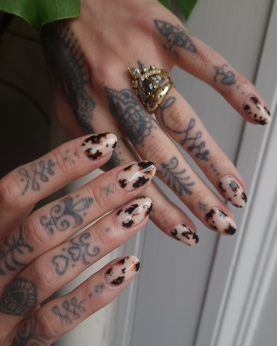Stylish cow print nails with edgy vibes