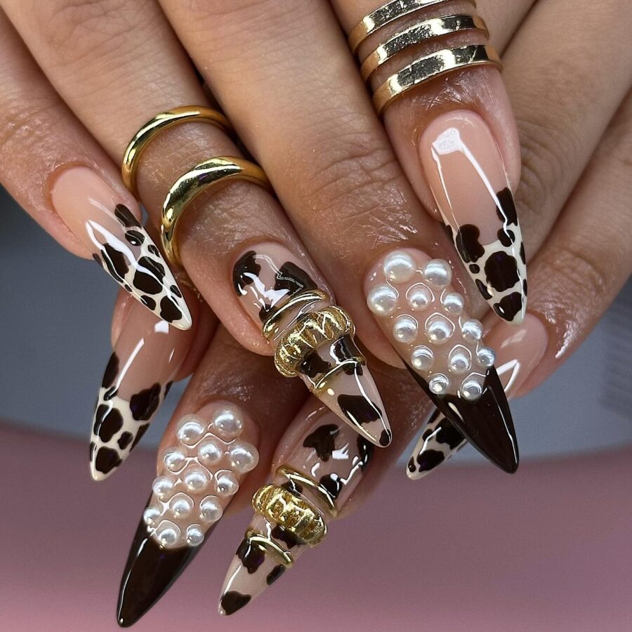 Chic cow print nails with elegant accents