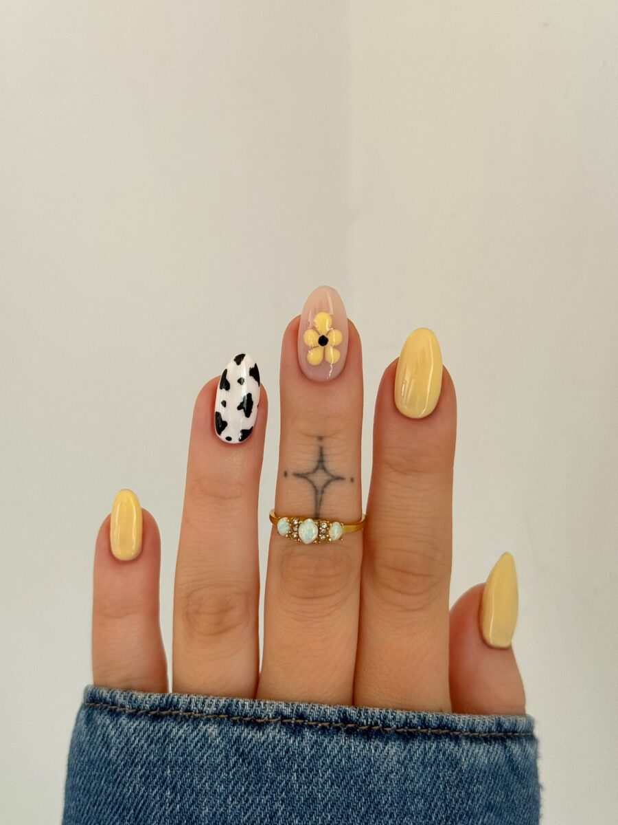Charming cow print nails with a floral twist