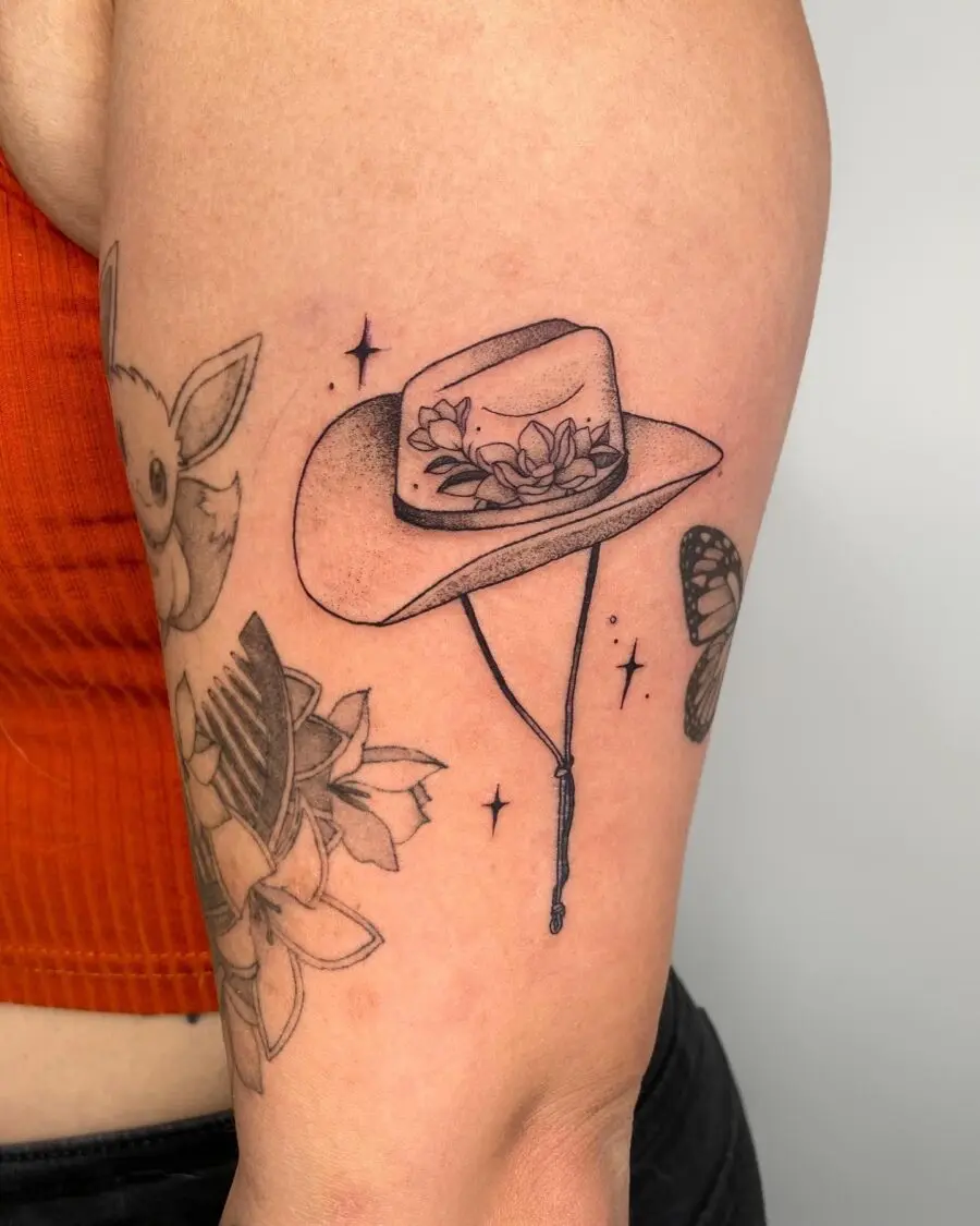 Charming hat tattoo adorned with floral motifs