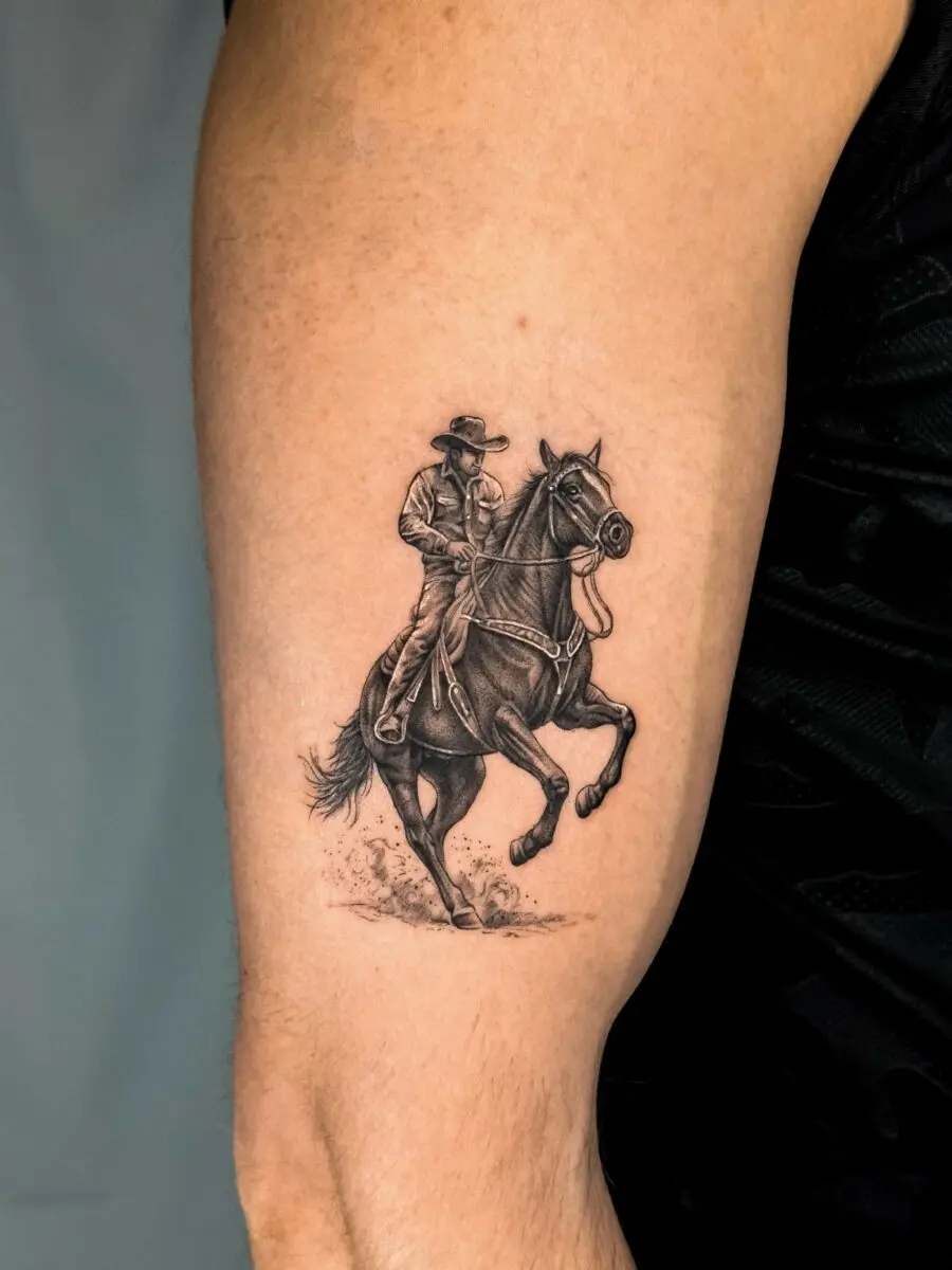 Detailed cowboy tattoo on a muscular arm