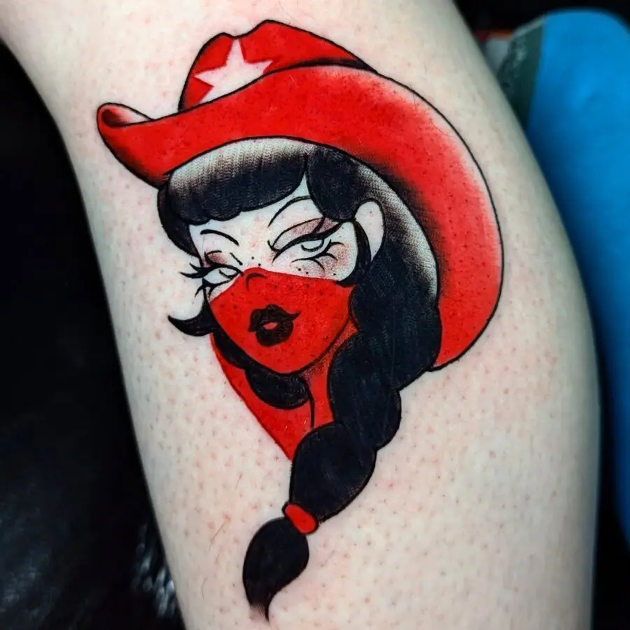 Stylish cowgirl tattoo with a bold twist