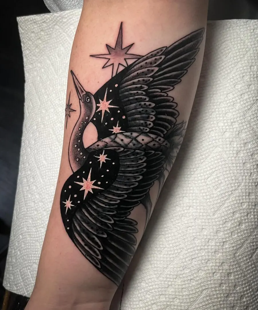 Elegant crane tattoo with cosmic elements