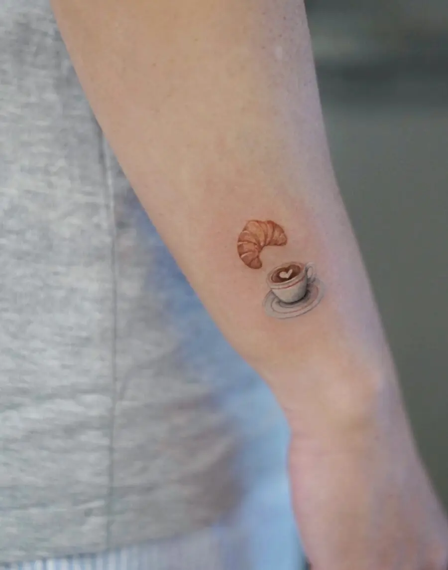 Charming croissant and coffee tattoo design