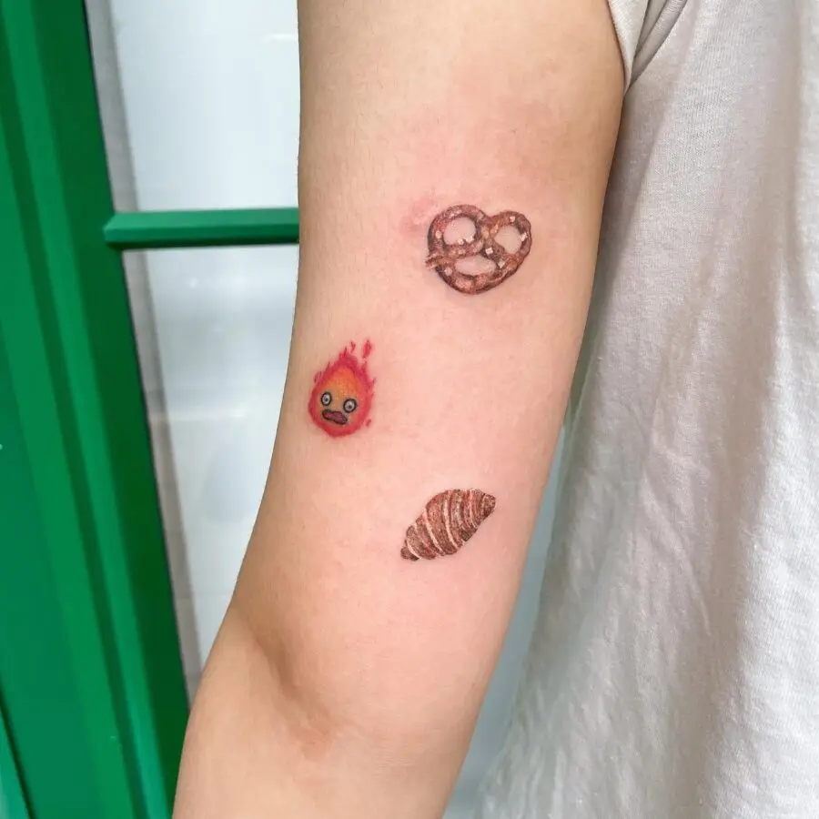 Vibrant Croissant and Snack-Themed Tattoos