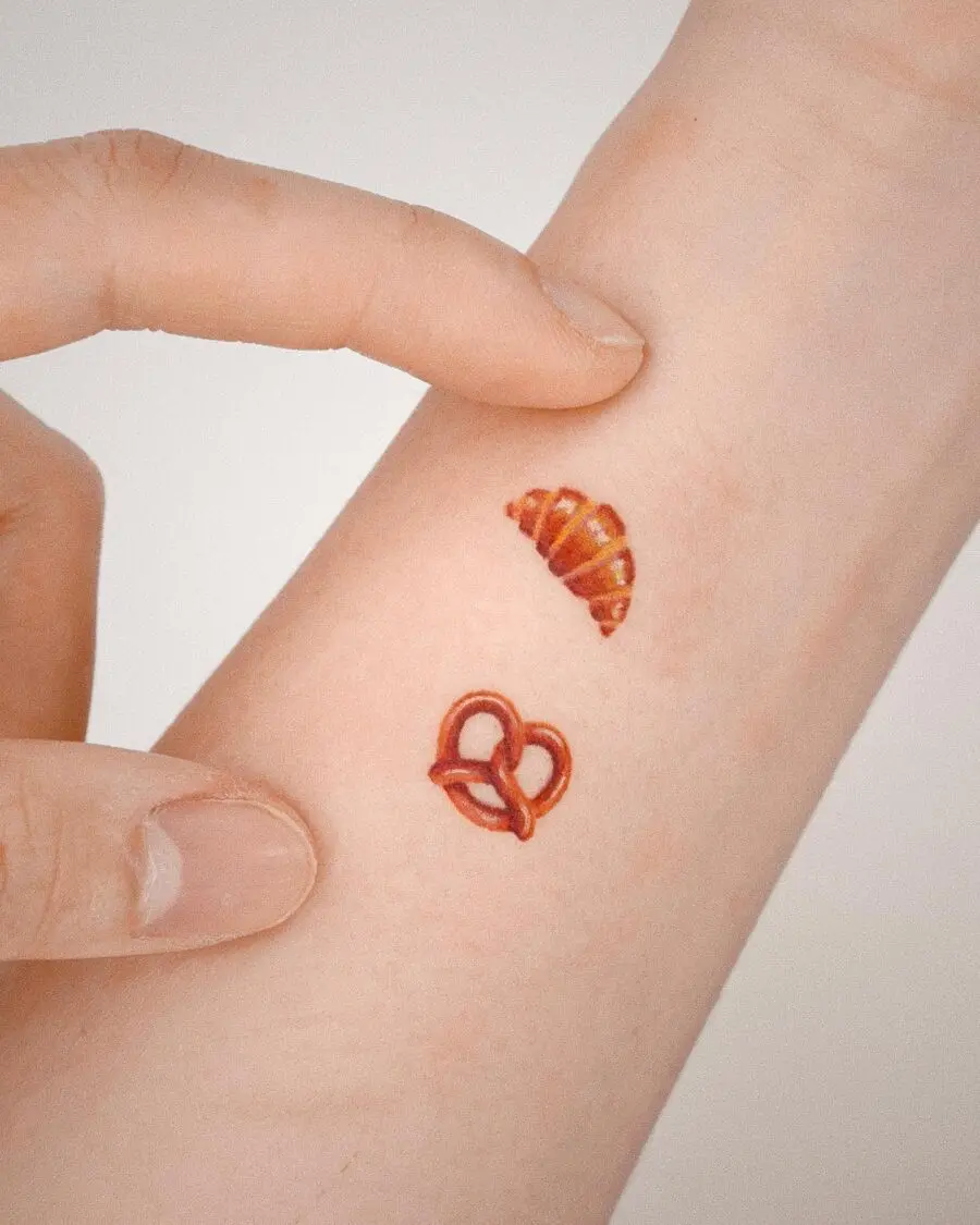 Charming Croissant and Pretzel Hand Tattoos
