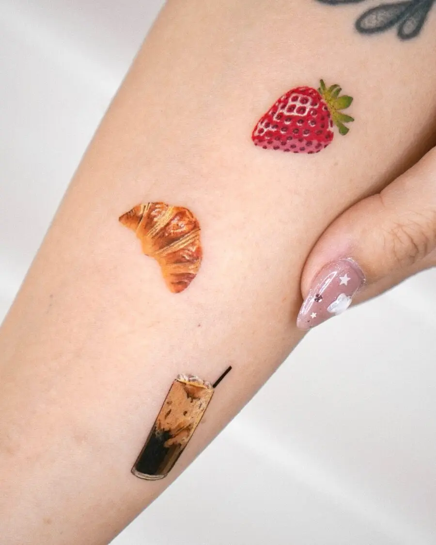 Charming croissant tattoo among tasty treats