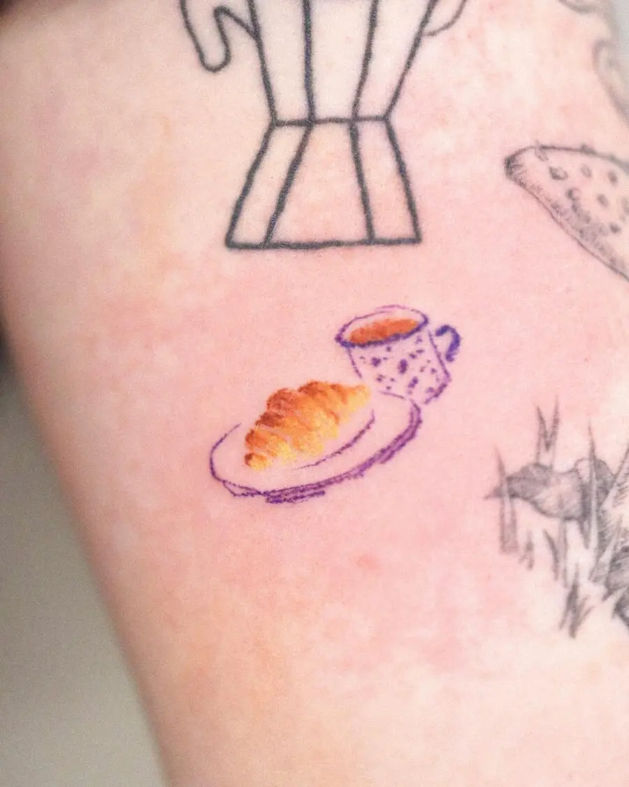 Delightful croissant and coffee tattoo design