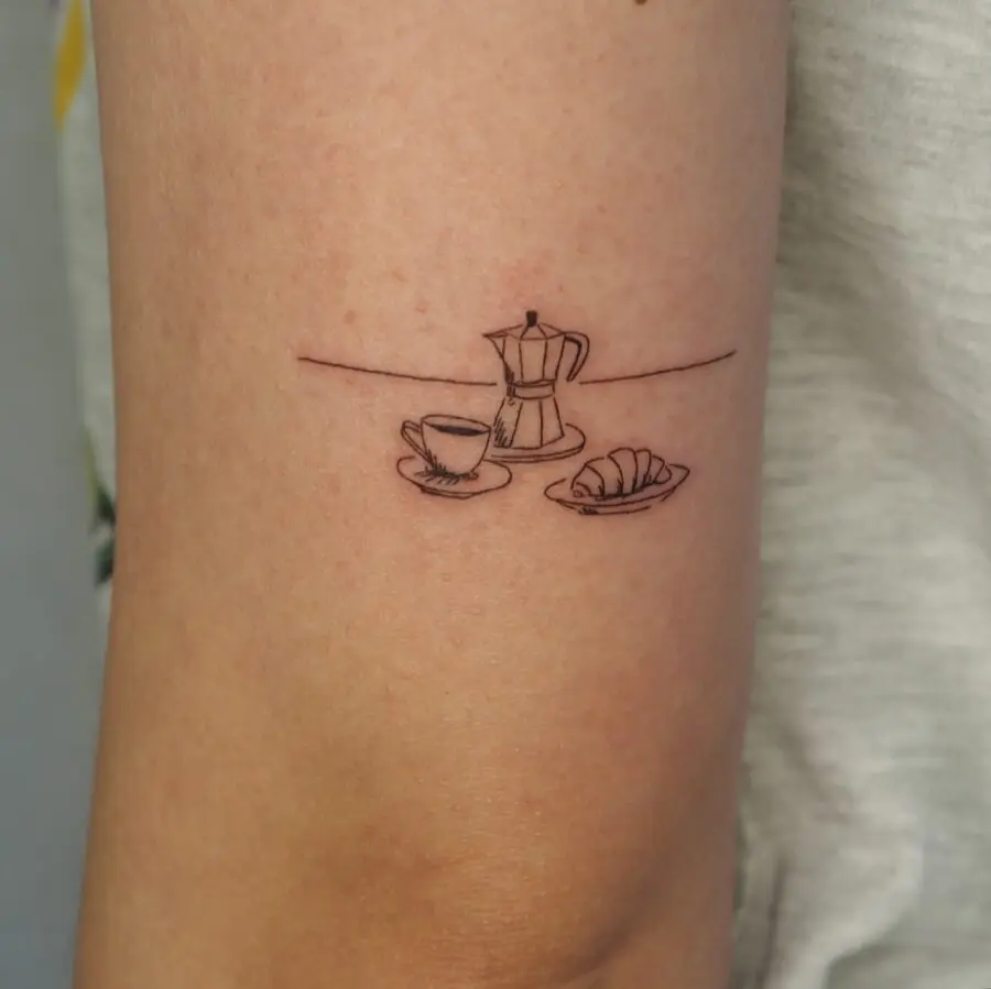 Charming croissant tattoo with coffee and moka pot