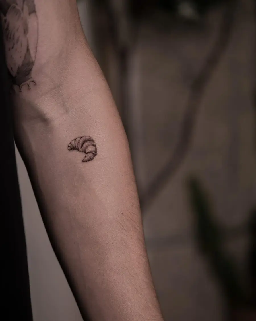 Charming Croissant Tattoo on the Forearm