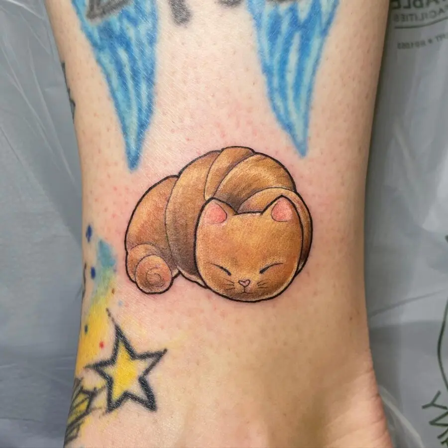 A playful twist on croissant tattoos