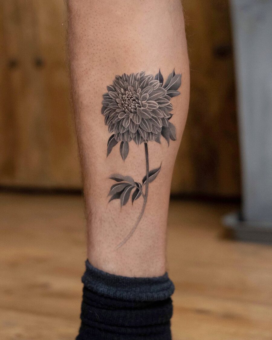 Elegant black and gray dahlia leg tattoo