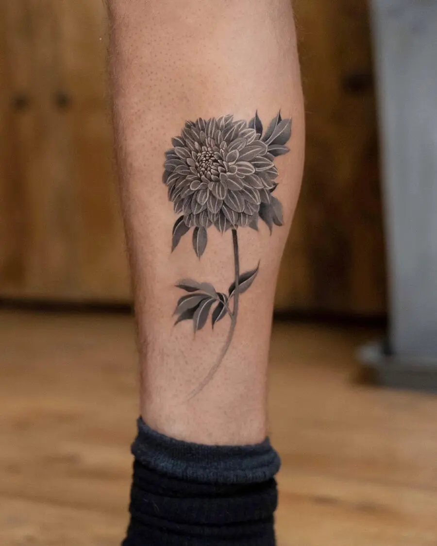 Elegant black and gray dahlia leg tattoo