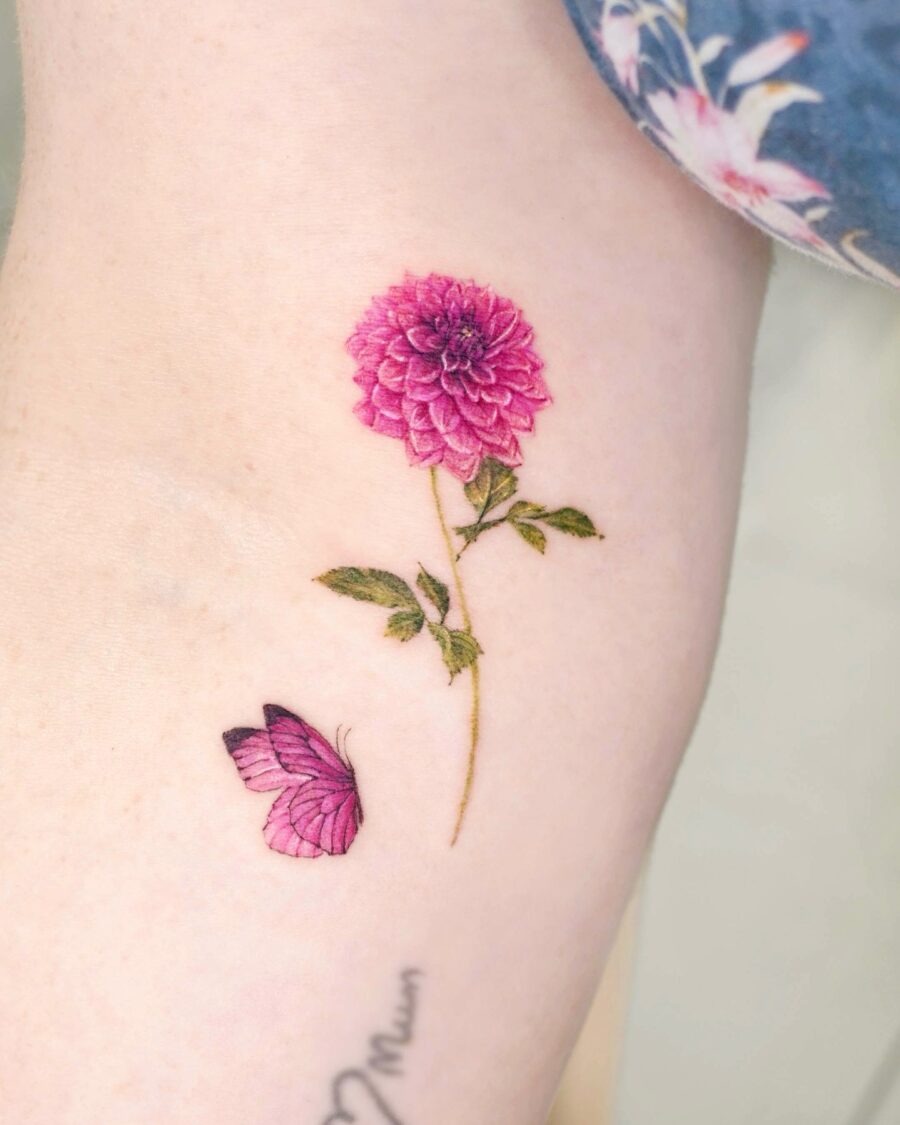Stunning dahlia tattoo with a butterfly companion