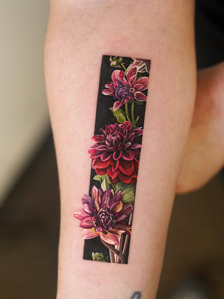 Stunning dahlia tattoo showcasing vibrant flowers