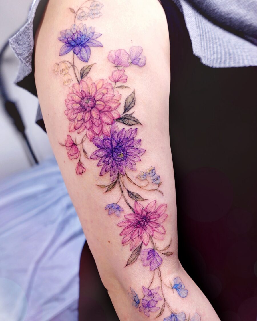 Elegant dahlia tattoo design with soft colors