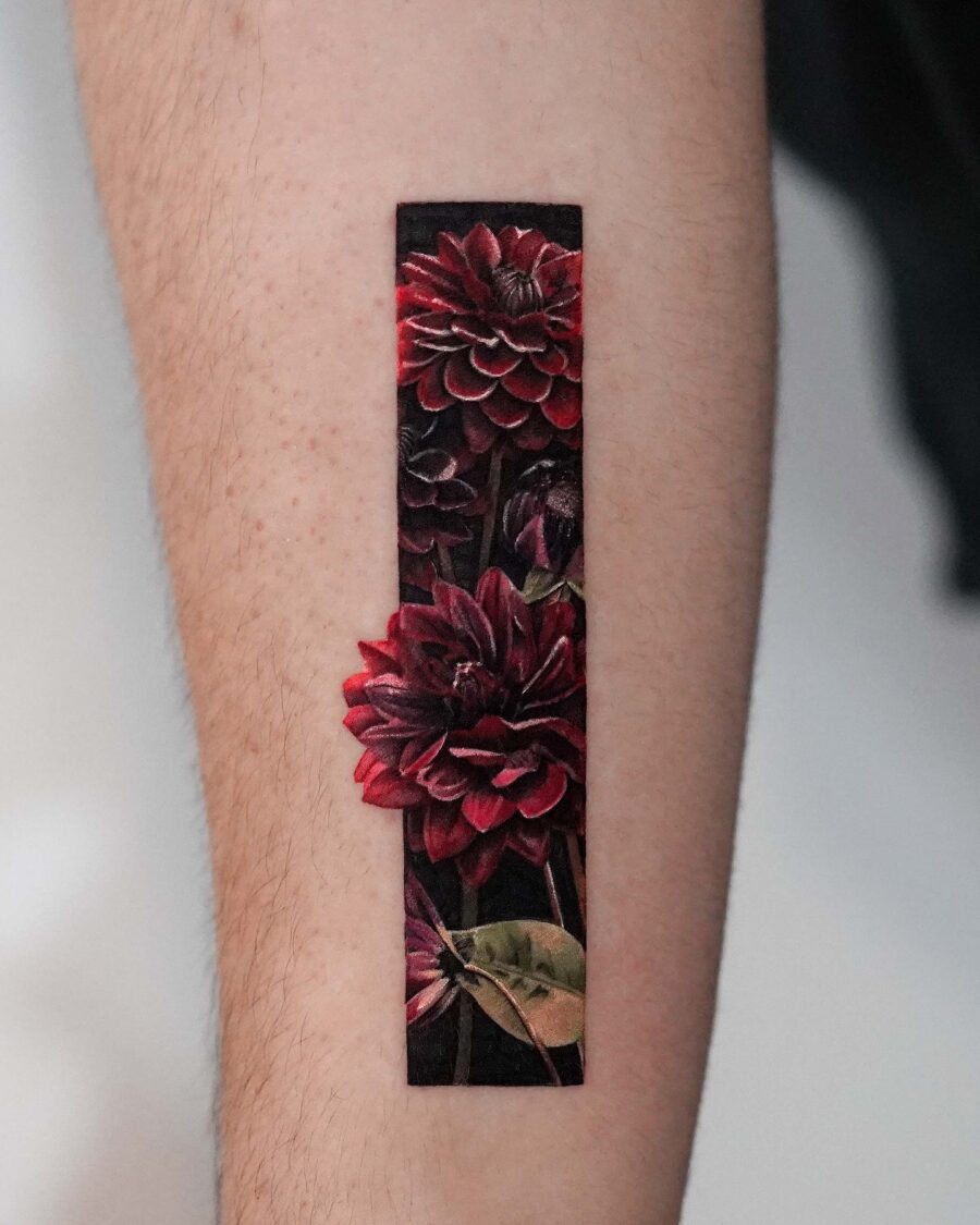 Vibrant Dahlia Tattoo with Dark Aesthetic