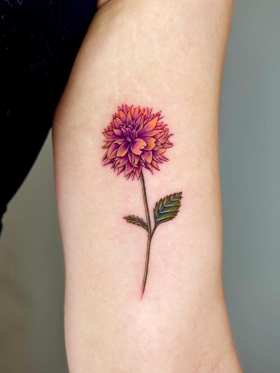 Stunning dahlia tattoo with vibrant colors