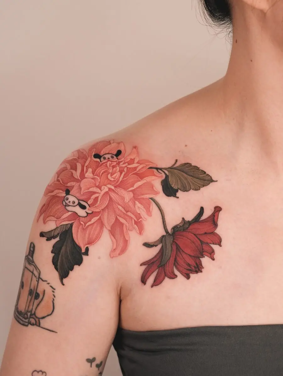 Charming dahlia tattoo with playful panda elements