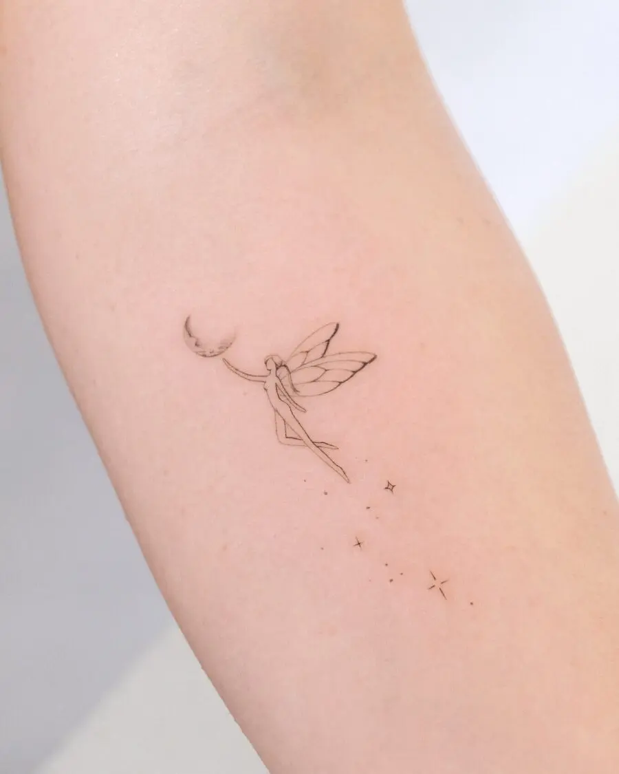 Whimsical fairy with moon and stars tattoo