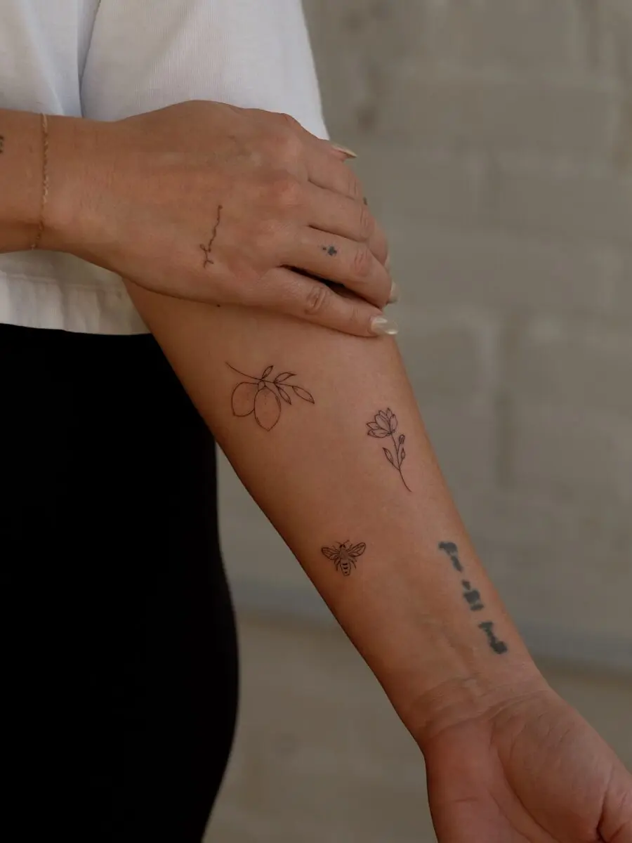 Charming minimalistic tattoos on the forearm.