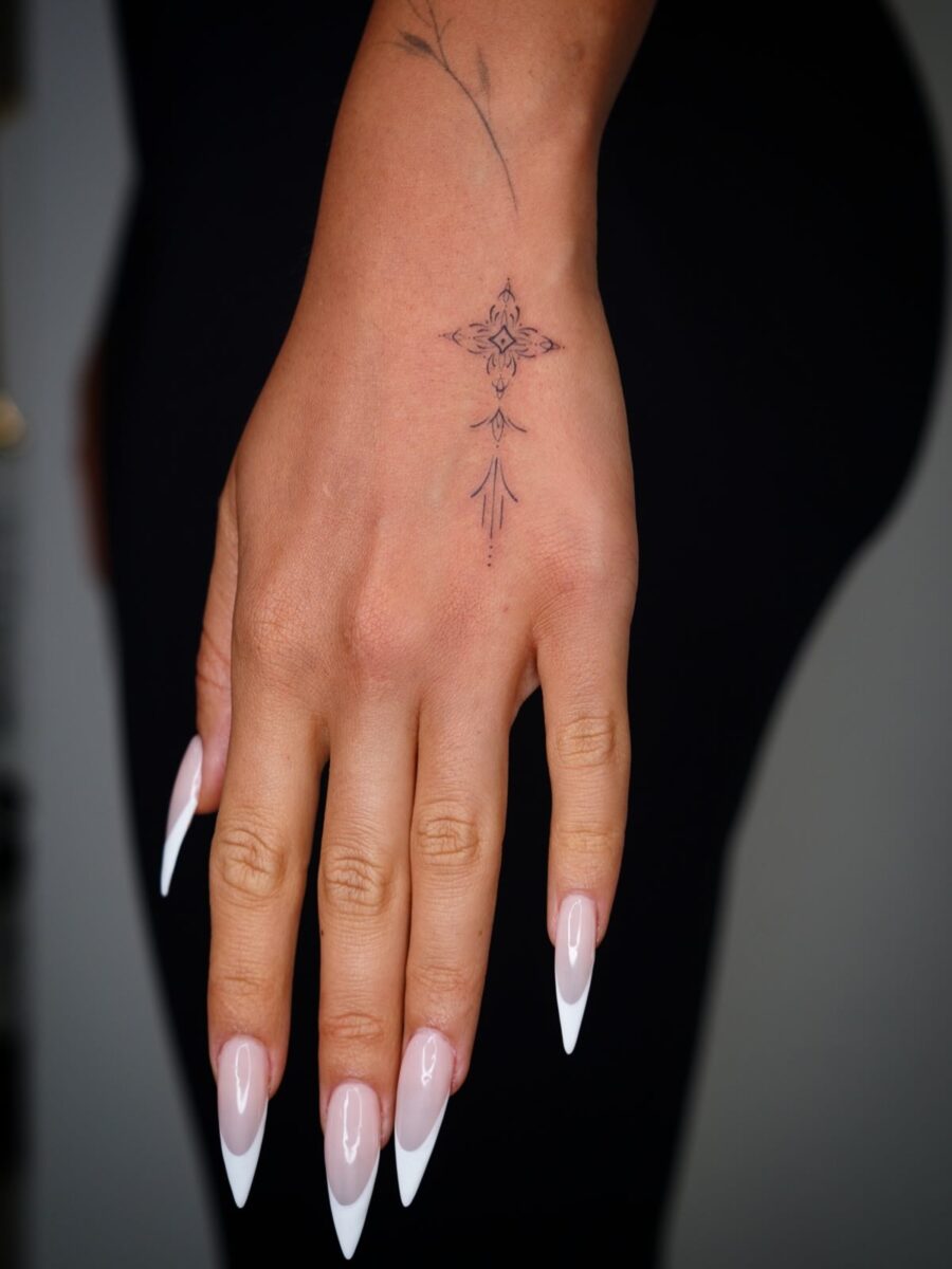 Elegant Hand Tattoo with Intricate Details