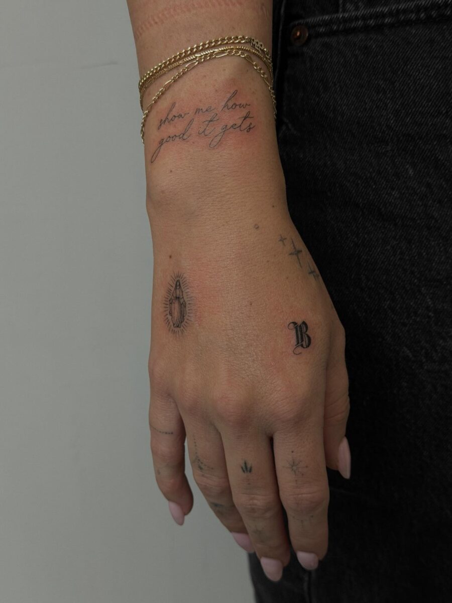 Elegant handcrafted tattoos on a delicate wrist.