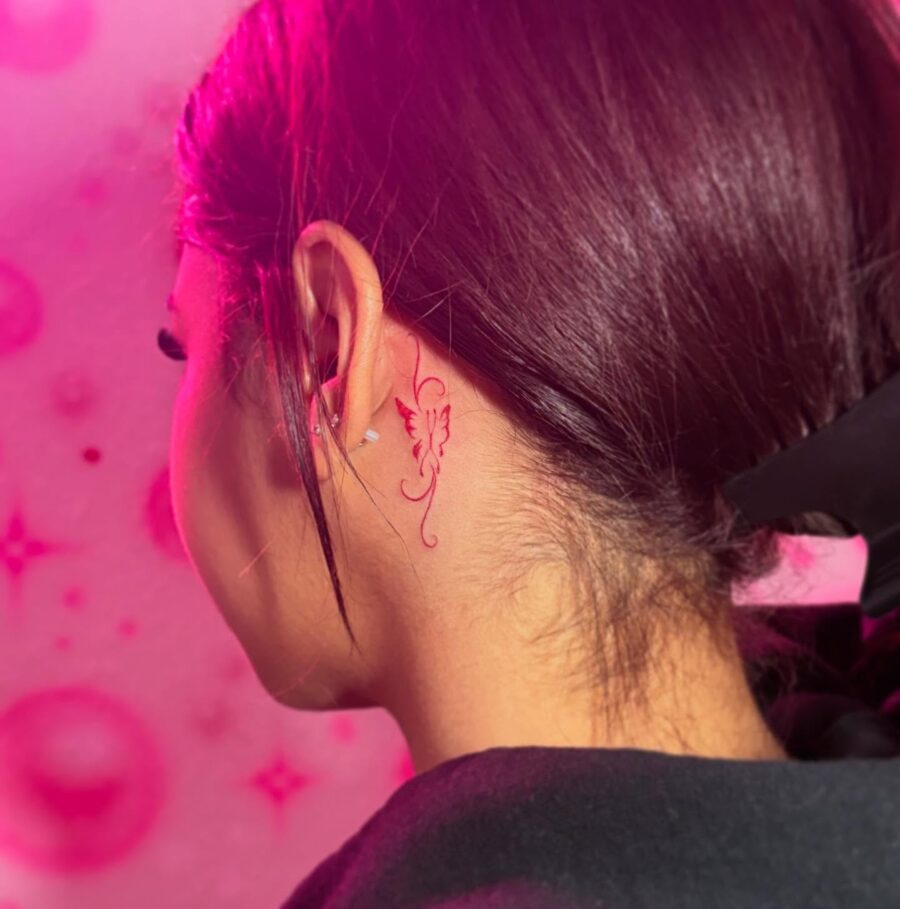 Elegant butterfly tattoo by the ear