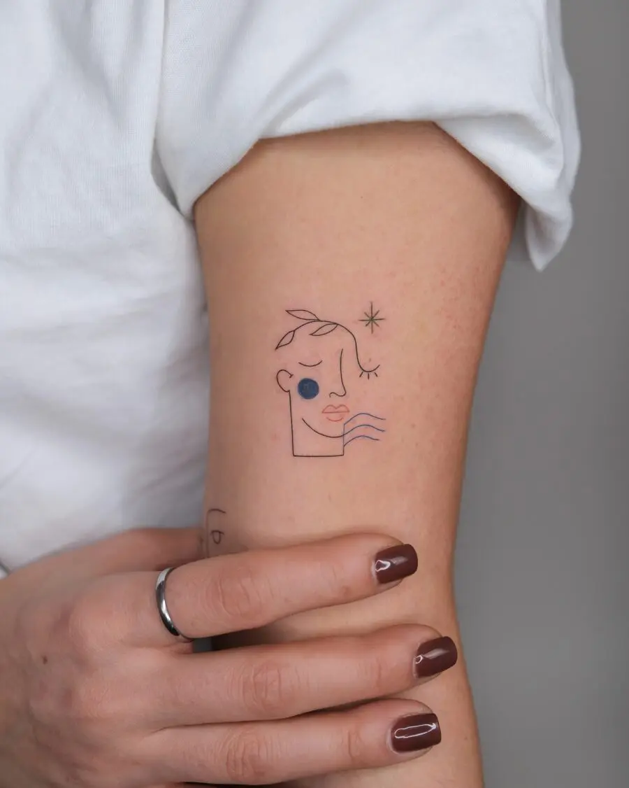 Minimalist face tattoo with artistic flair