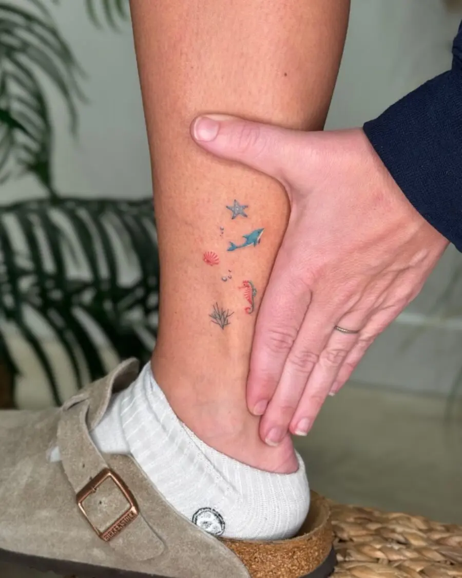 Charming aquatic-themed dainty tattoos for the ankle
