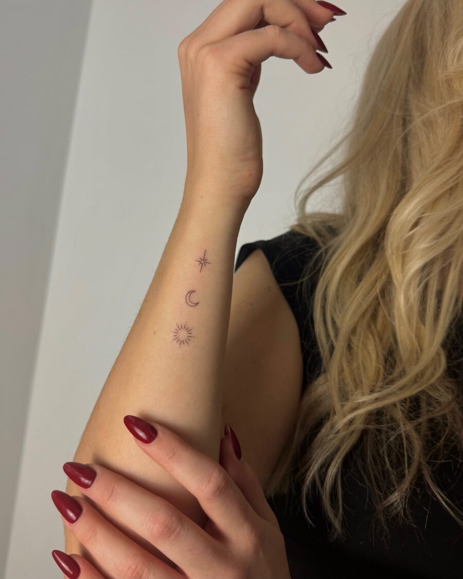 Elegant celestial designs on forearm