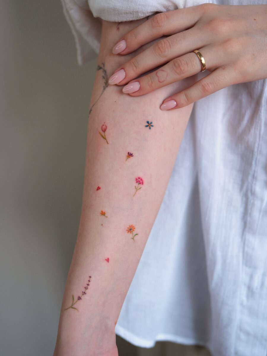 Charming Floral Dainty Tattoos on a Delicate Arm
