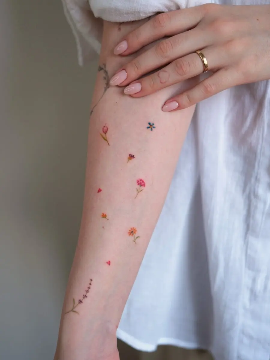 Charming Floral Dainty Tattoos on a Delicate Arm