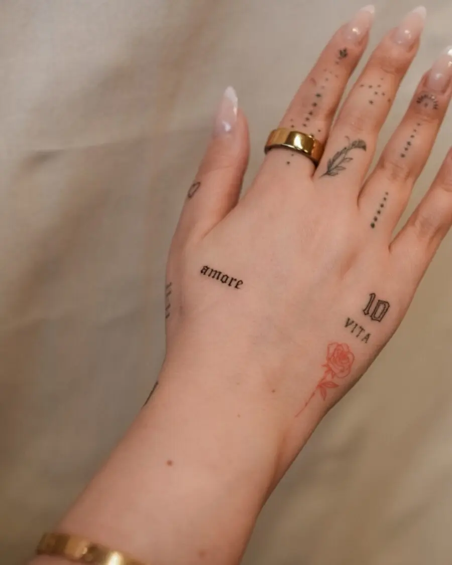 Chic dainty tattoos accentuating delicate hands