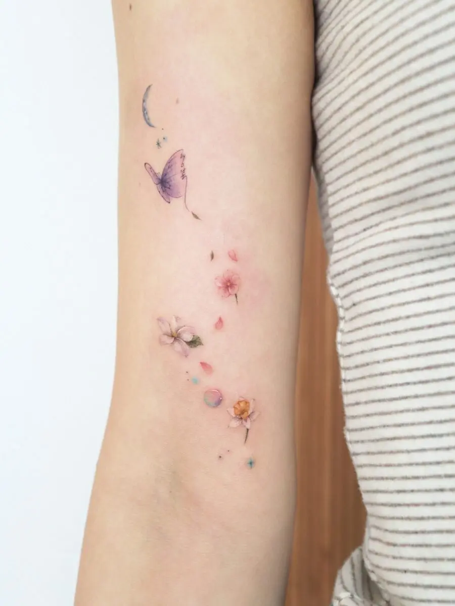 Stunning floral and butterfly tattoo combination