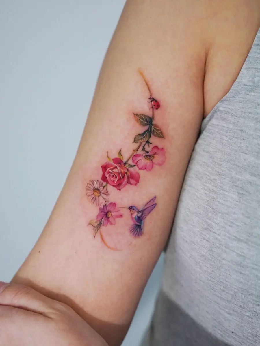 Charming floral and bird tattoo design blend
