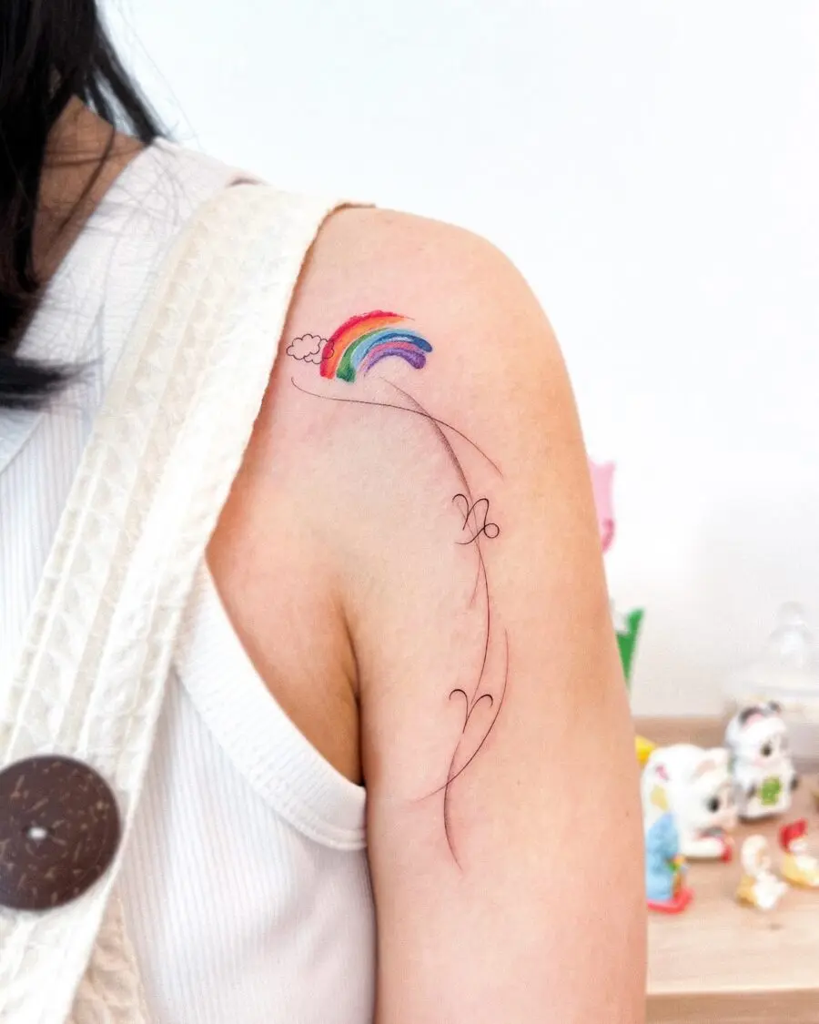 Charming rainbow baby tattoo on shoulder