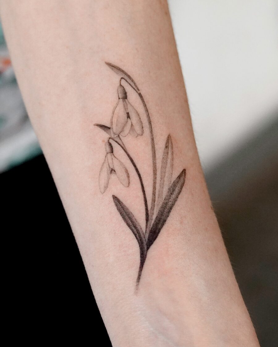 Elegant snowdrop tattoo with delicate details