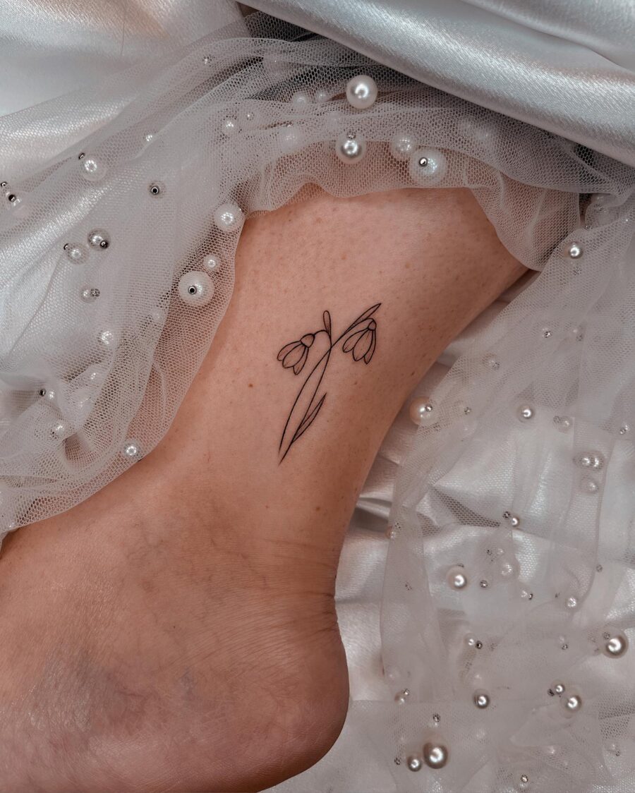 Elegant snowdrop tattoo on the ankle