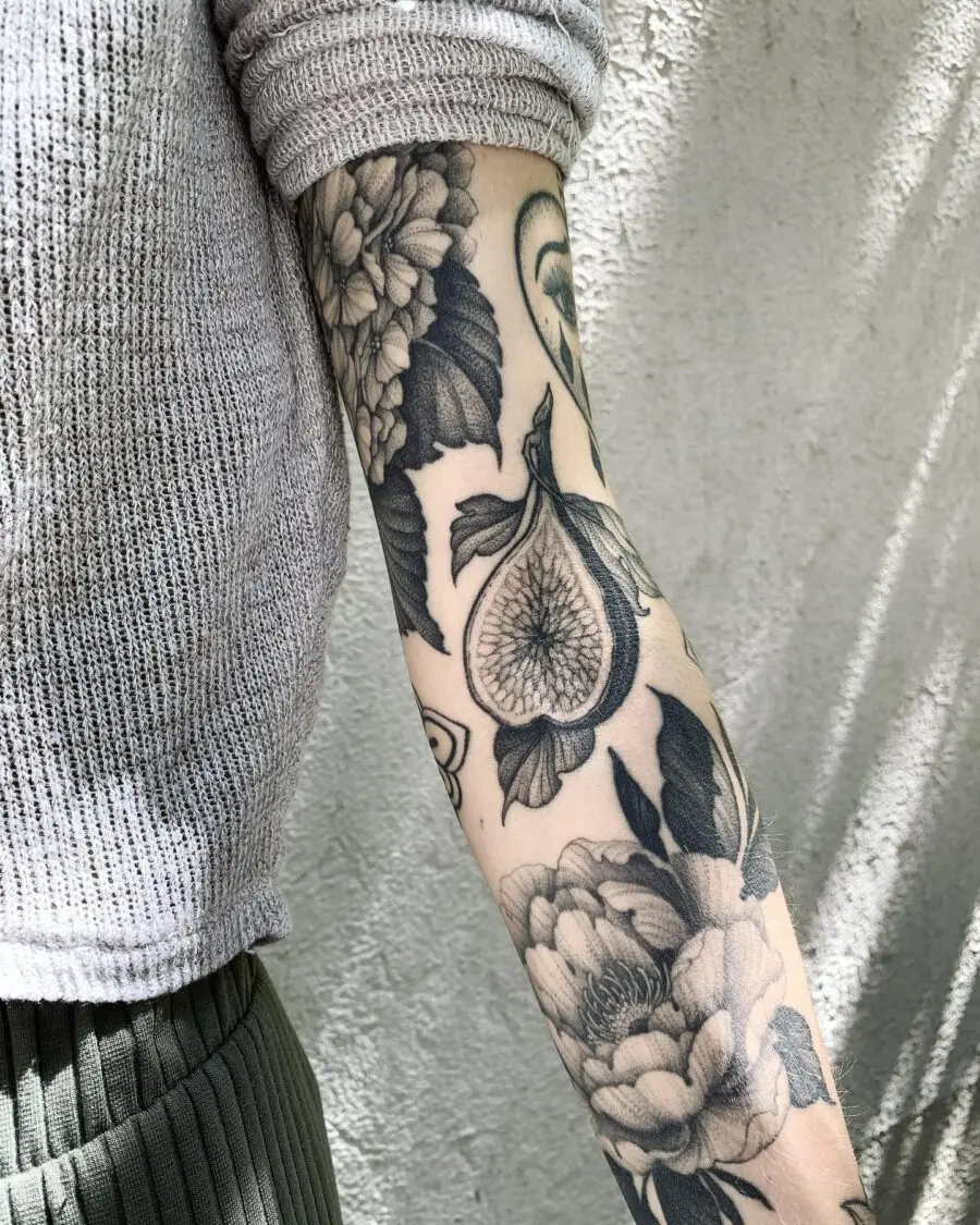 Intricate floral cover-up tattoo on arm