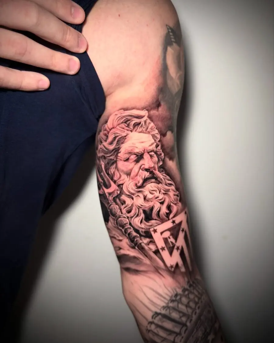 Epic Greek god tattoo on muscular bicep