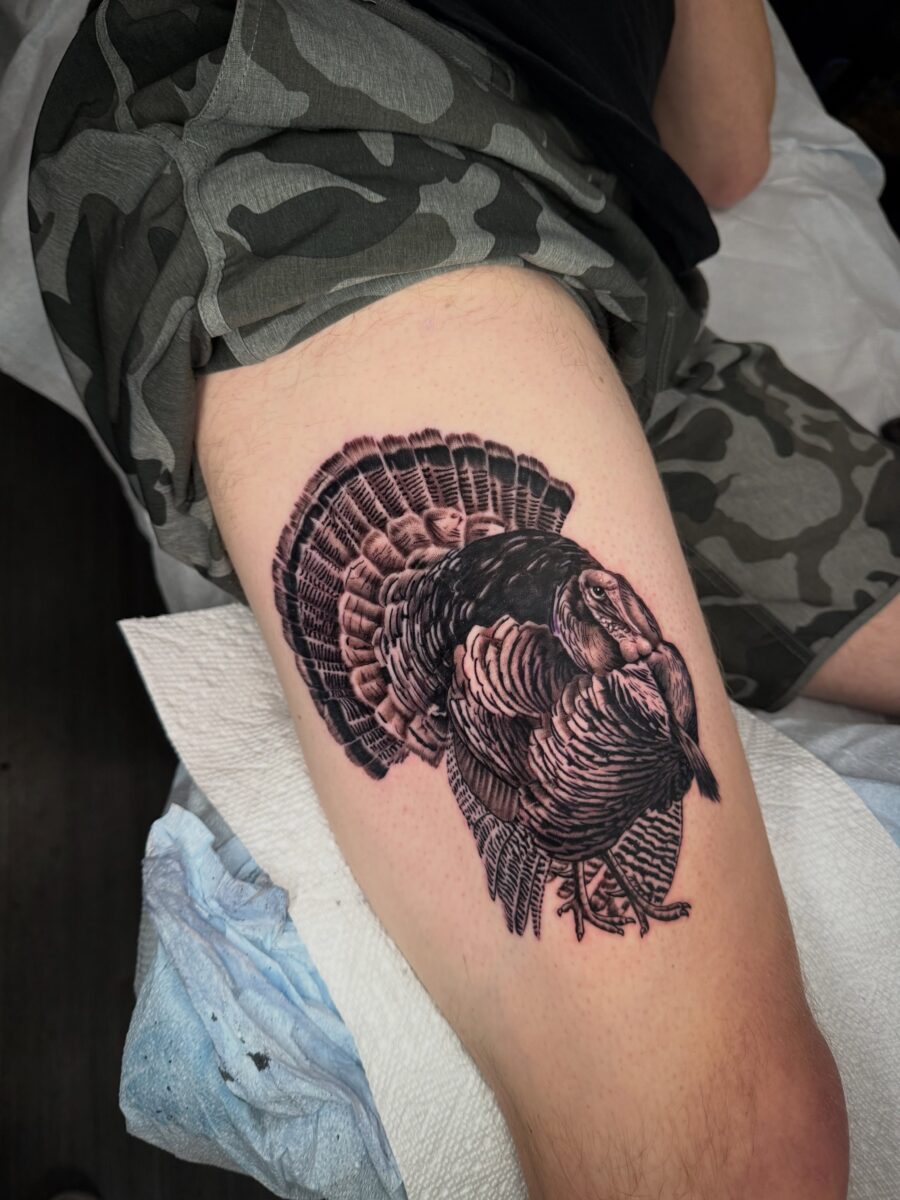 Intricate black and gray turkey tattoo design