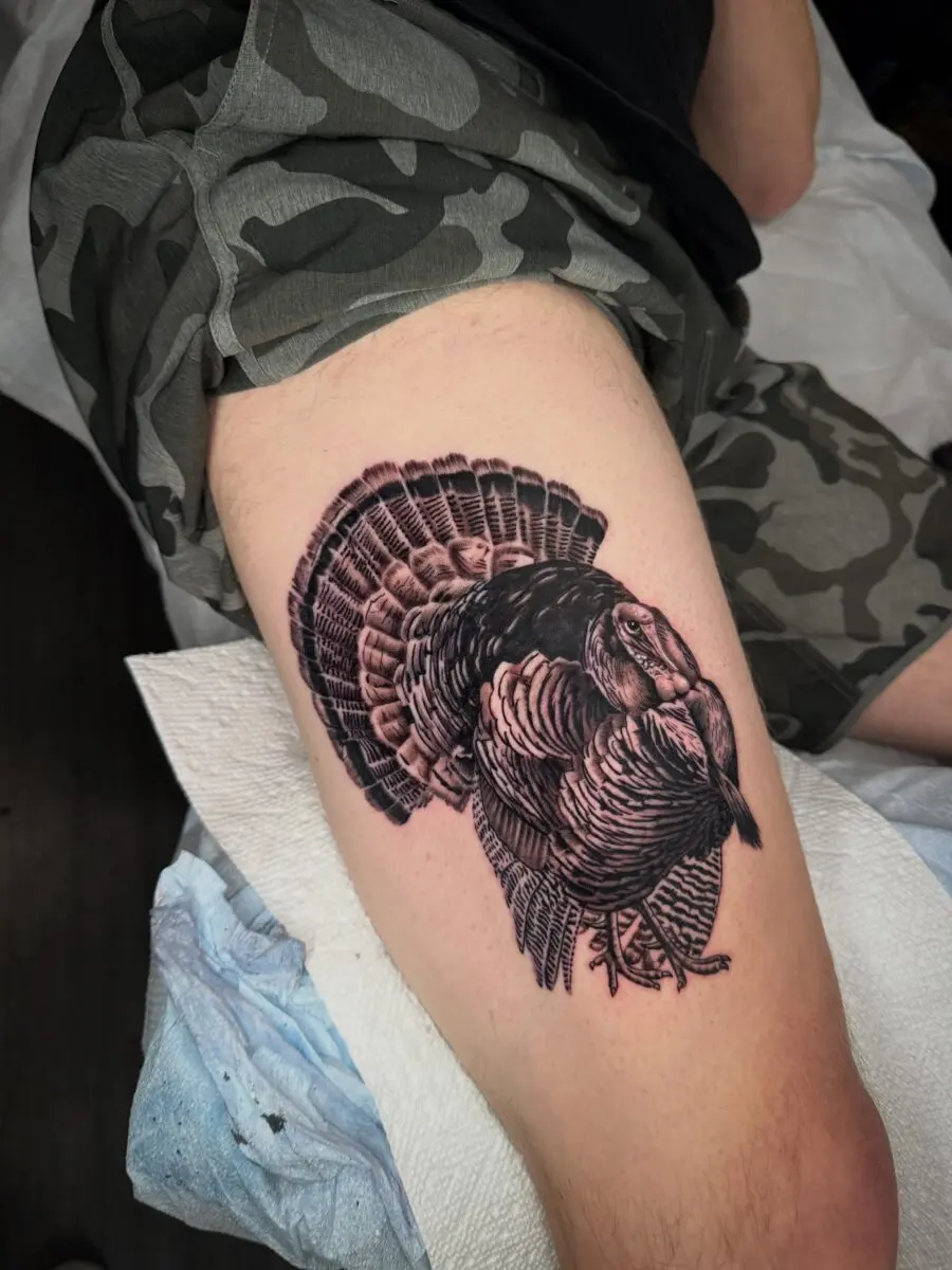 Intricate black and gray turkey tattoo design