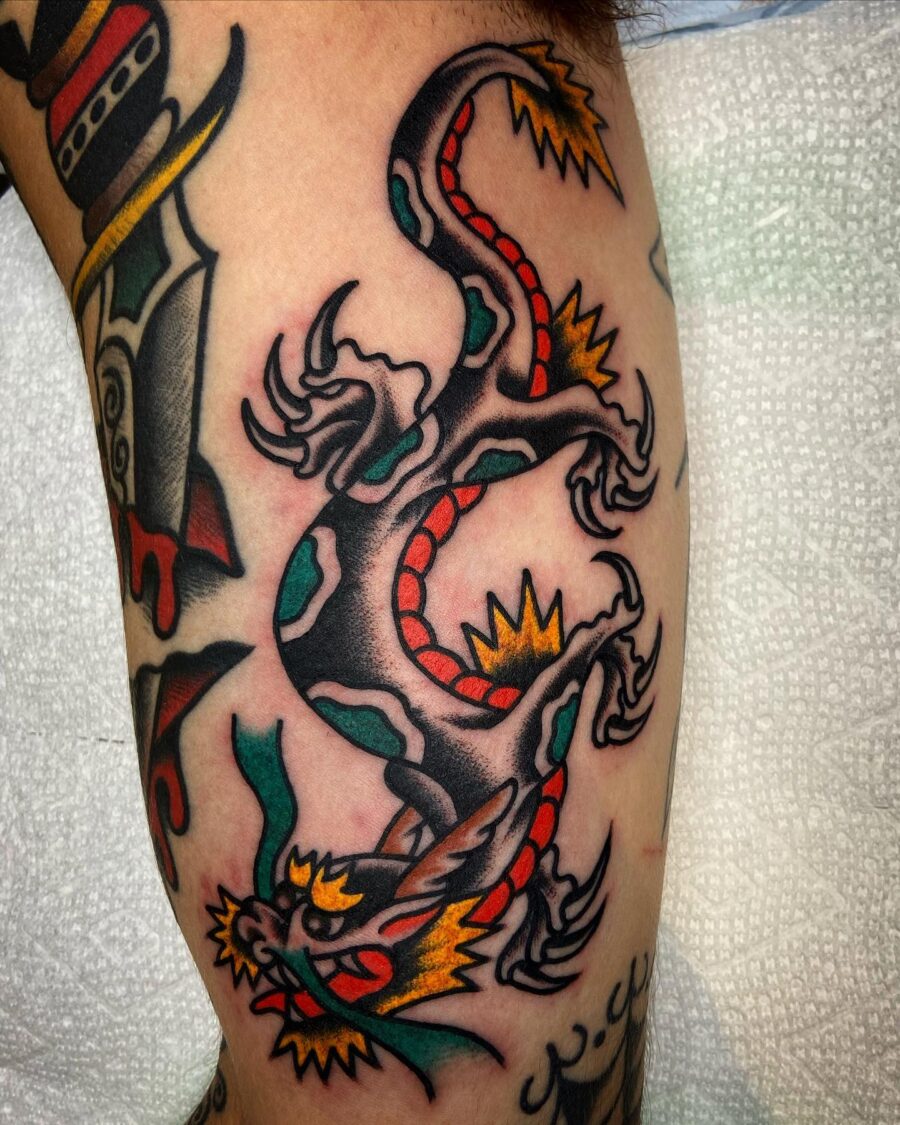 Bold dragon tattoo design on biceps