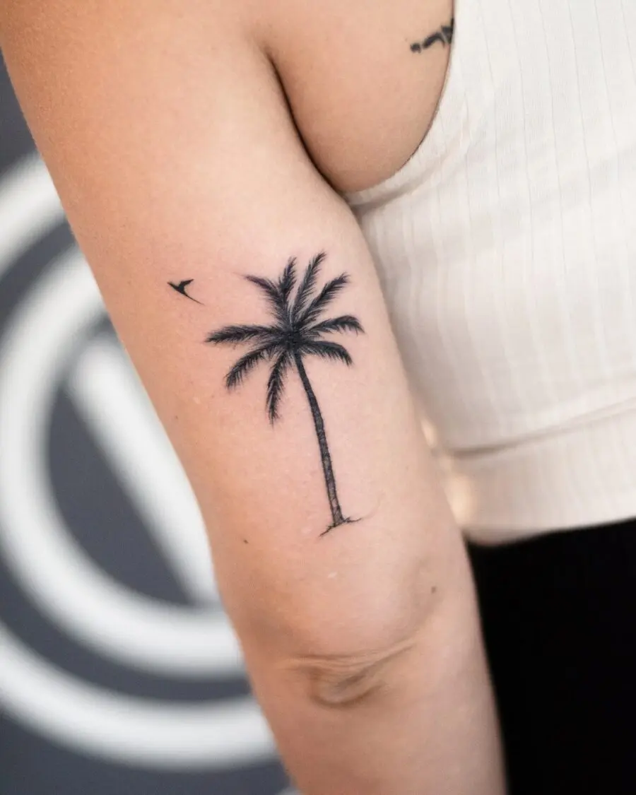 Stylish palm tree tattoo with a minimalist vibe