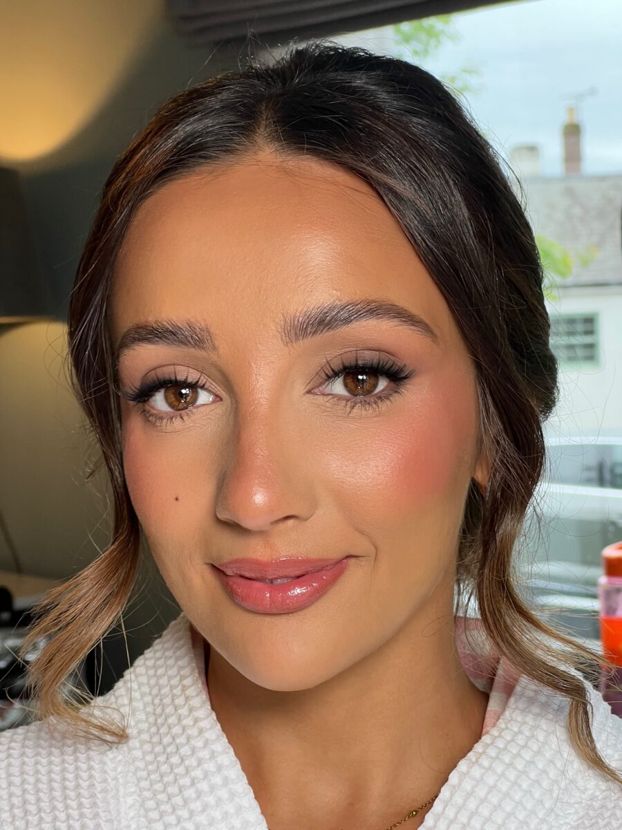 Elegant and glowing wedding guest makeup look