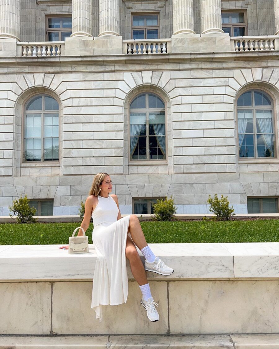 Chic white outfit paired with sleek sneakers